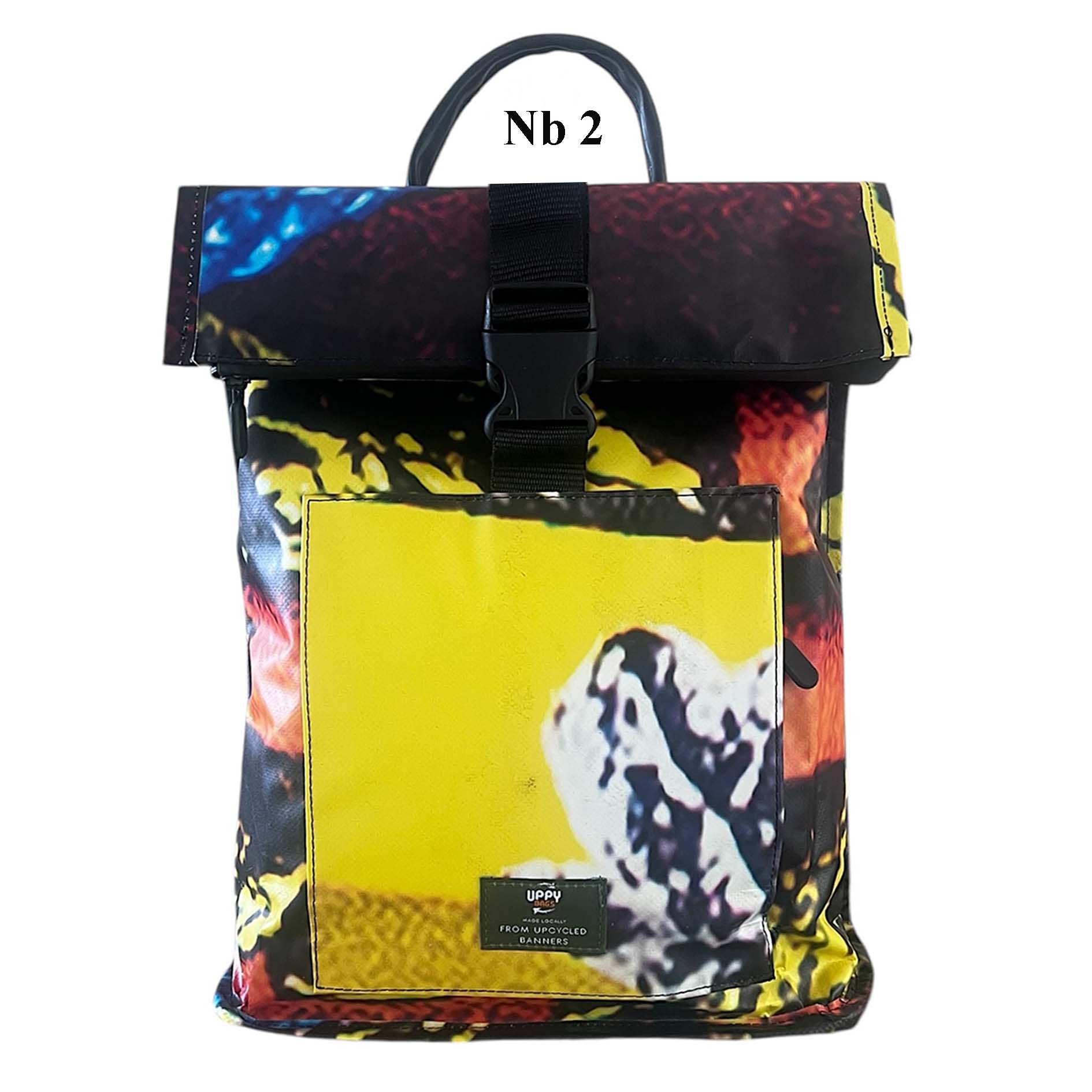 Multicolored backpack with a yellow square featuring a black and white design on a white background. Upcycled from building banner, waterproof
