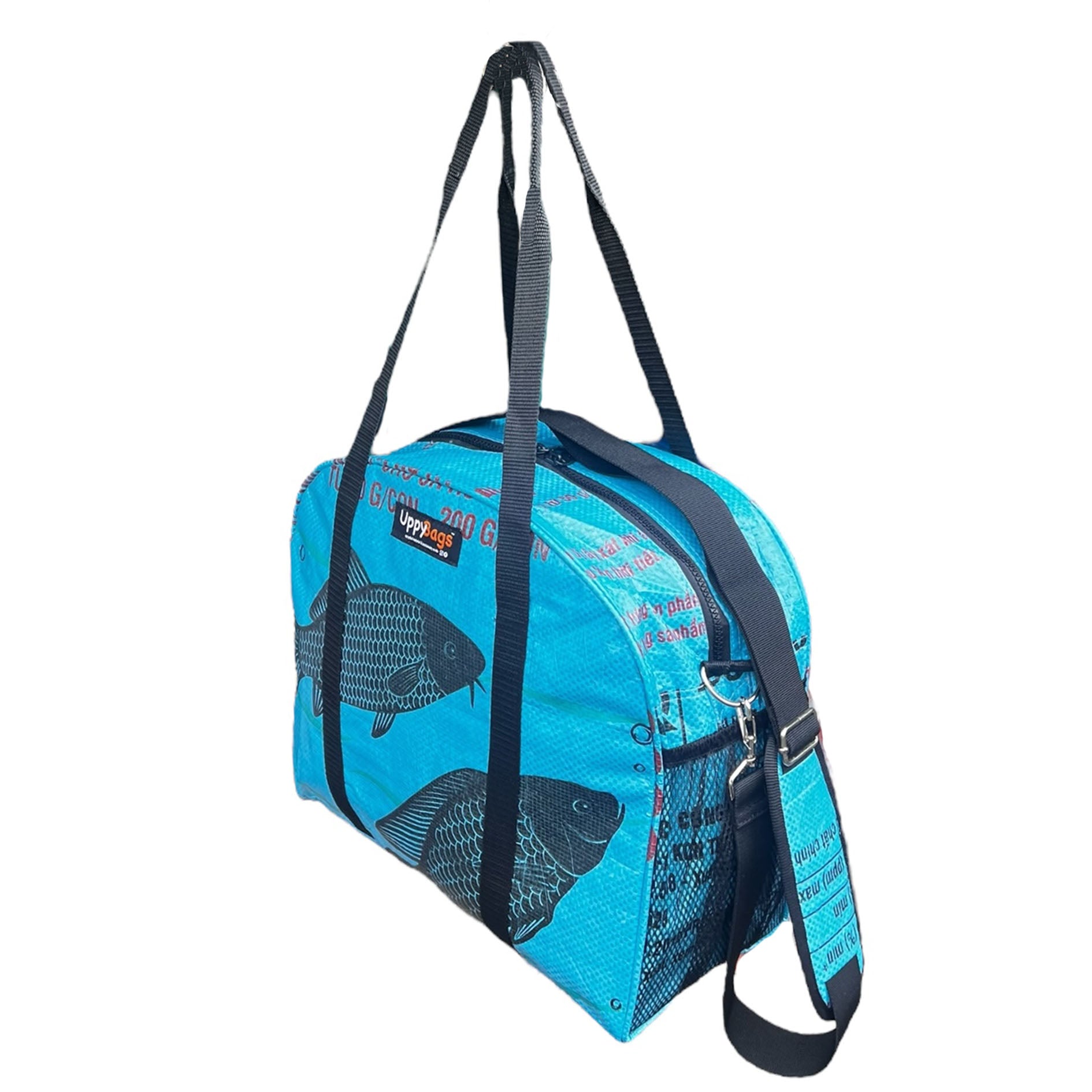 Blue duffel bag with fish pattern and visible brand logo on a white background