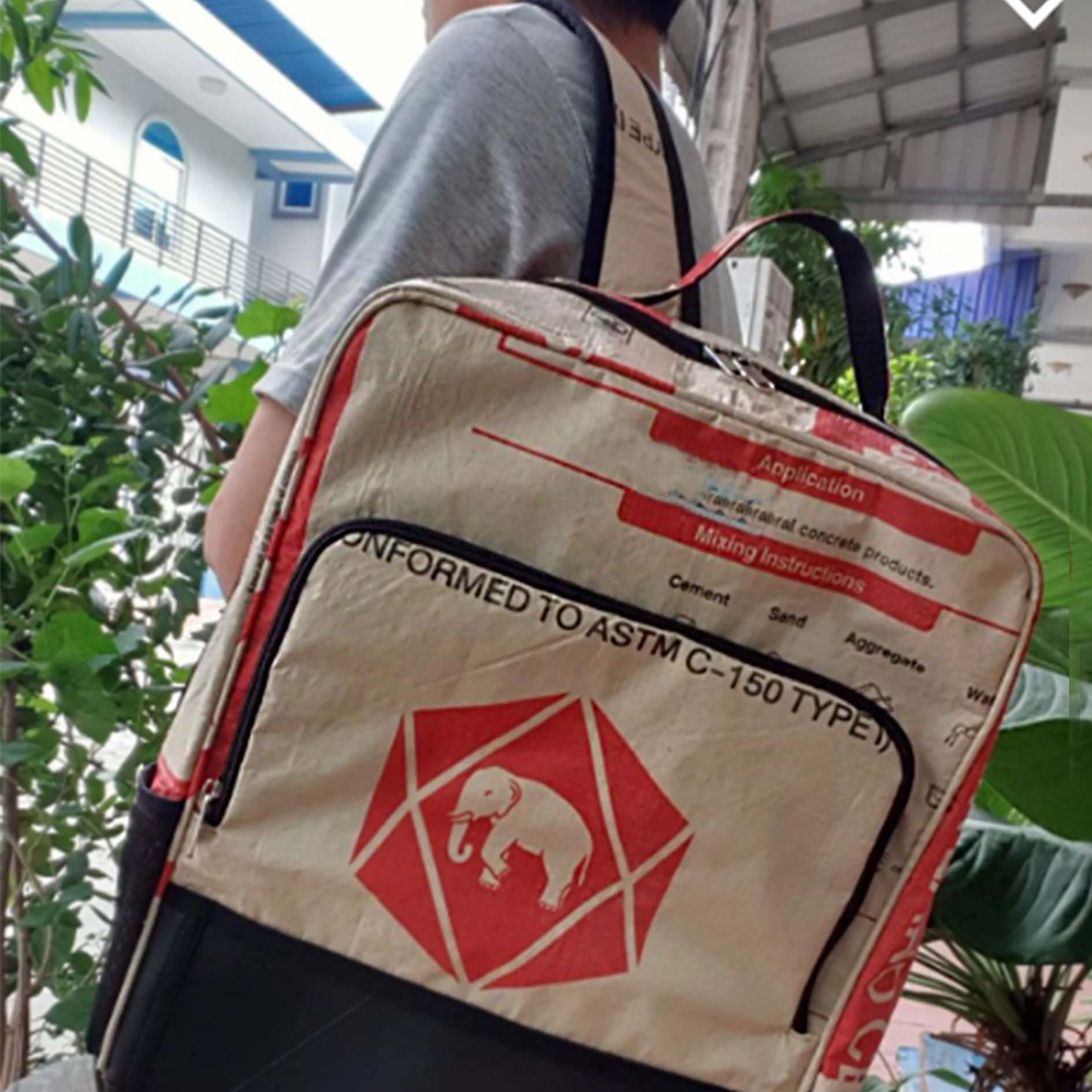 Recycled material backpack with animal print and car tyre