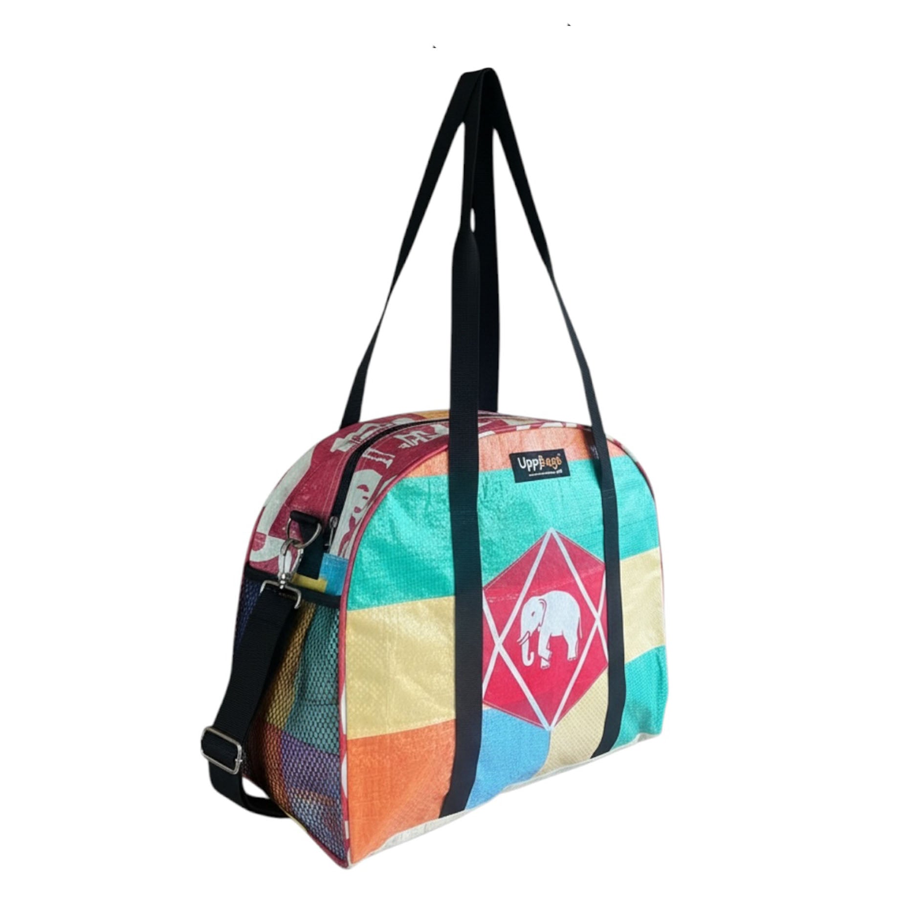 Colorful geometric-patterned bag with black straps on a white background