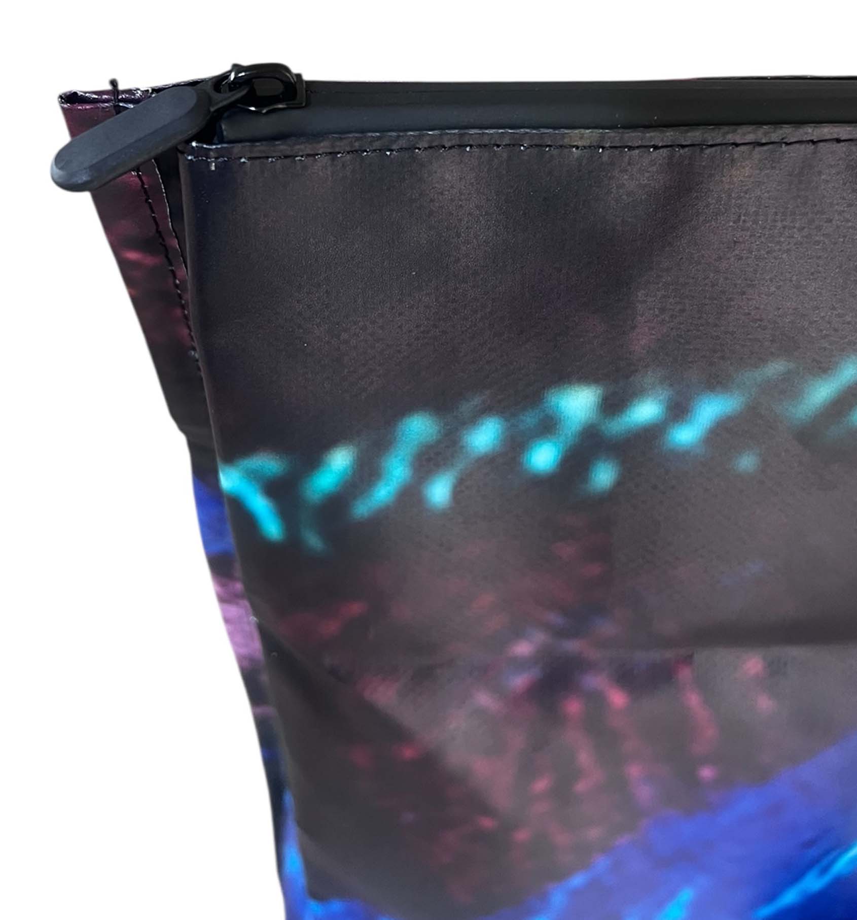 Close-up of a multicolour backpack with colourful abstract design on a white background