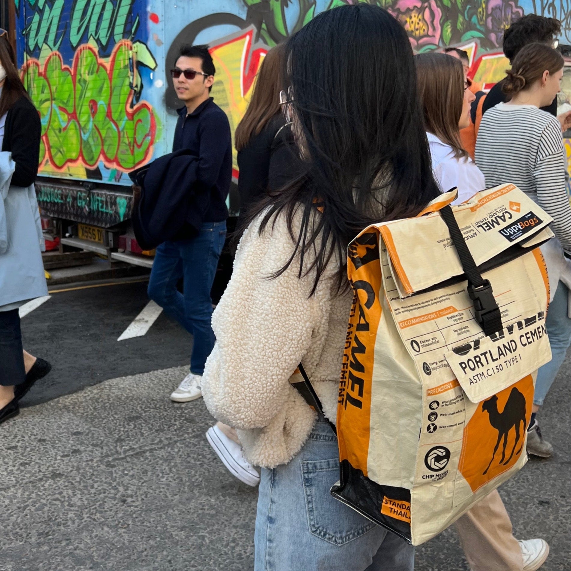 Recycled material backpack roll-top with animal print and model