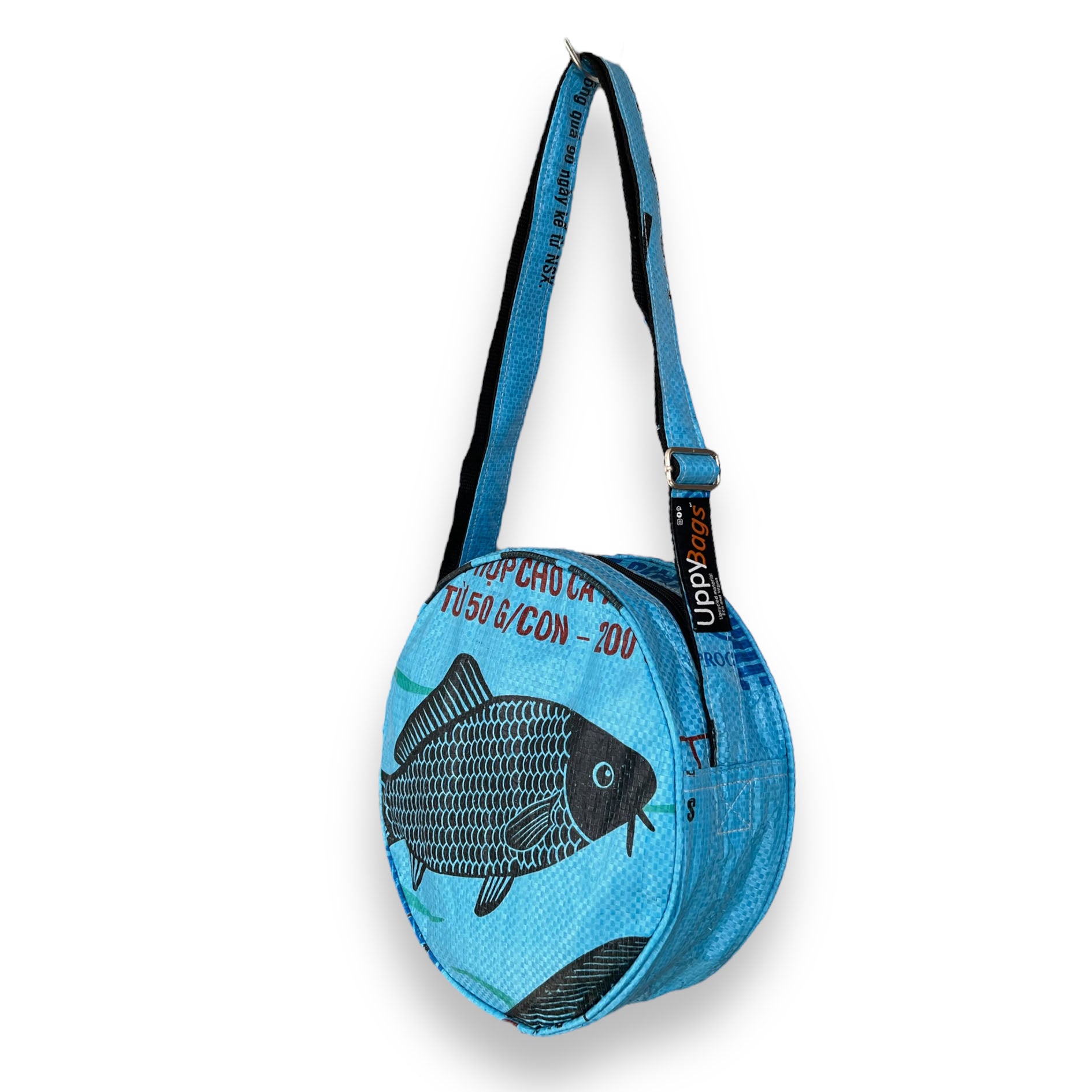 Recycled material shoulder bag UK. Blue fish print round crossbody bag UK